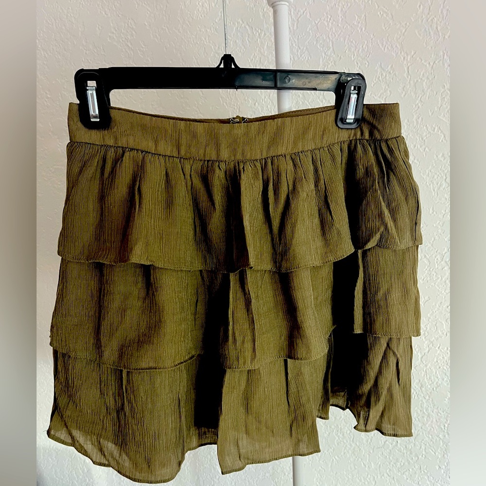 Army green skirt.